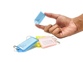 Hand holding a name tag