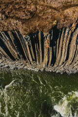 Aerial view of basalt columns and glacial river at Studlagil Canyon, Iceland...