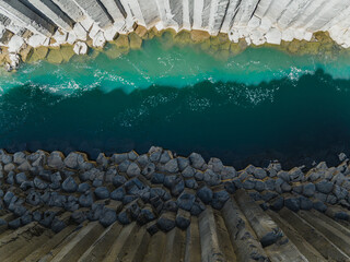 Aerial view of basalt columns and turquoise river in Studlagil Canyon, Iceland...