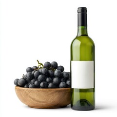Obraz premium Wine Bottle and Dark Grapes Displayed in a Wooden Bowl on a White Background