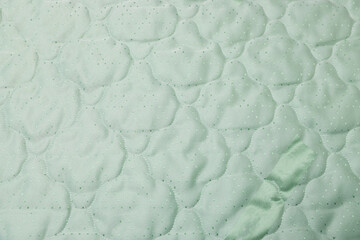 New soft mattress as background, top view