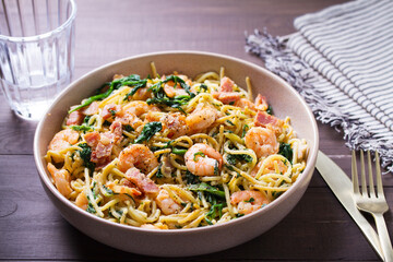 Prawn and bacon pasta with spinach. Spaghetti