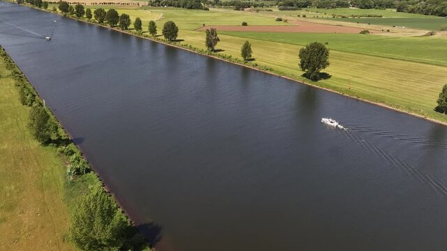 22th of May 2025 - aerial view of the river Maas in Brabant along a dike with trees
