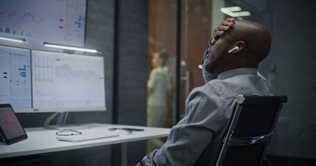 Stock Exchange Broker Shouting During Call, Soaking Financial Loss, Monitoring Real-Time Stocks on Multi-Monitor Computer in Office. African American Investment Agent Angry About Bad Economy News.