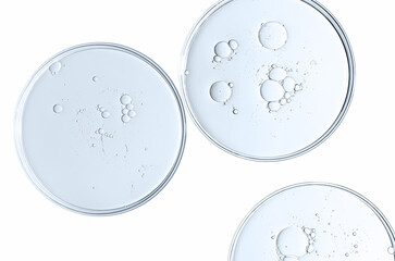 The texture of a cosmetic serum or body gel in a Petri dish.