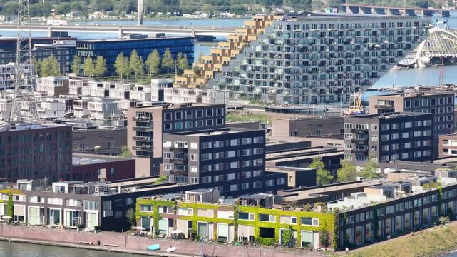 Amsterdam, Noord Holland, Netherlands - May 22th 2025: Aerial view of IJburg district with special architecture on the water