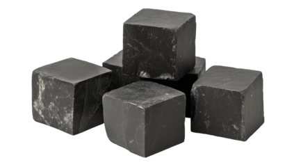 Five dark gray, roughly hewn cubic stones, piled loosely, showing veining and texture