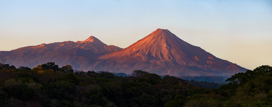A breathtaking view of two majestic volcanoes in Colima, Mexico