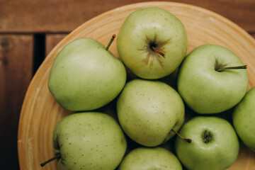green apples on a wooden table