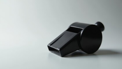 Classic black plastic whistle, simple design, clean background , white background, whistle