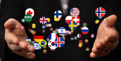 Image of hands gently holding numerous flags representing global reach and international business.
