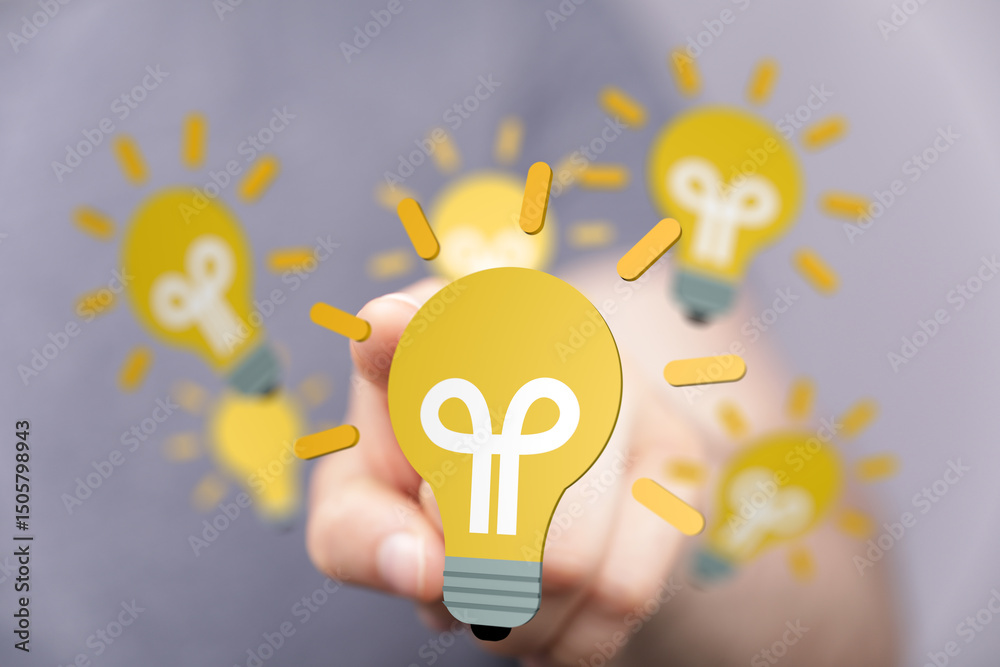 Aufkleber boost your creativity! stock photo of hand selecting a lightbulb, symbolizing innovation and new ide