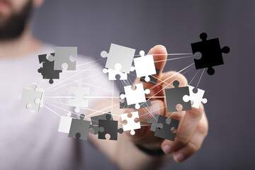 Abstract image of puzzle pieces connecting, symbolizing teamwork, collaboration, and...