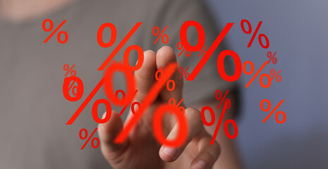 Person interacts with digital percentage signs.  Financial, discount, interest, savings concept.