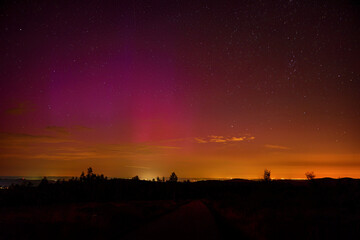 Northern lights over Czech landscape