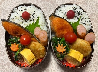 A traditional Korean dosirak, beautifully arranged with rice, assorted banchan, and savory proteins. Balanced and visually inviting, it’s a portable meal packed with vibrant flavors.