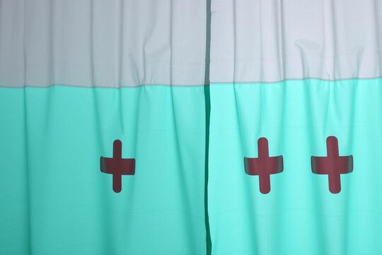 Vibrant Teal and Gray Flag with Three Distinctive Red Cross Symbols