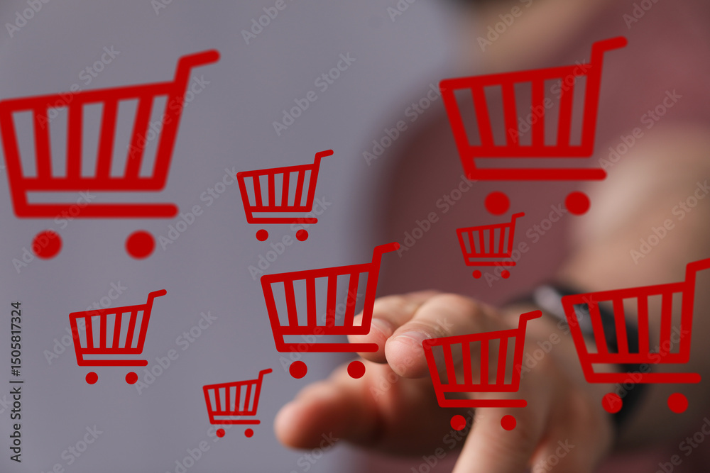 Poster person interacts with floating shopping carts, symbolizing online shopping and e-commerce.