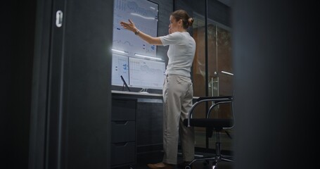 Female Financial Analyst Having Phone Call, Analyzing Real-Time Stocks, Exchange Market Charts on...