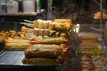 Korean street food skewers in warm mood, freshly cooked at Seoul, South Korea, Myeongdong Market stall