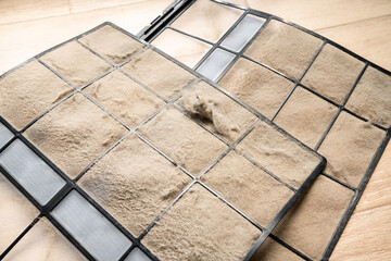 Dirty Air Filter in HVAC System Covered with Dust, Causing Health Issues, Respiratory Problems, and Low Indoor Air Quality