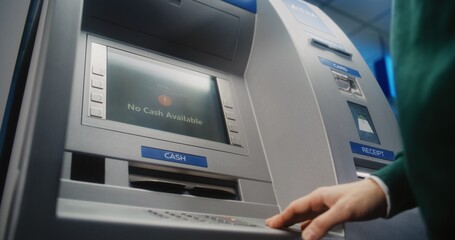 Unrecognizable Person Entering PIN Code on ATM Keypad to Withdraw Money. Error Message on Cash Machine Display About Transaction Cancellation Due to No Cash Available. Banking Equipment. Close Up.
