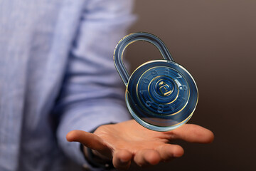 Secure your data! Image of a combination lock in a hand, representing digital security and data...