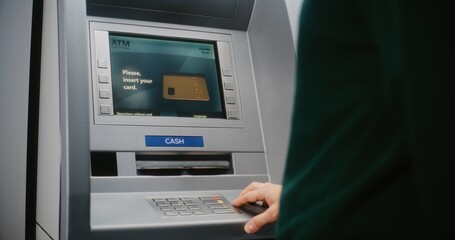 ATM User Entering PIN Code on ATM Keypad for Money Withdrawal. Error Message on Cash Machine Screen About Cancelled Transaction Due to Blocked Card. Cash Transactions, Banking System. Close Up Shot.