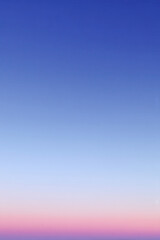 soft and delicate gradient of sky transitioning from ultrabright blue to gentle pink with subtle hints of lavender