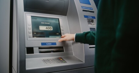 Unrecognizable Person Entering PIN Code on ATM Keypad to Withdraw Money. Error Message on Cash Machine Display About Transaction Cancellation Due to No Cash Available. Banking Equipment. Close Up.