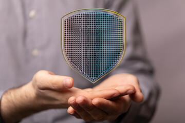 Secure your data with robust cybersecurity.  Image depicts digital shield.
