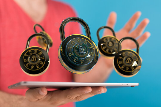 Image of combination locks hovering over a tablet, symbolizing online security and data protection.