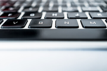 Abstract view of a typical computer keyboard showing the low profile keys together with the long, horizontal space bar.