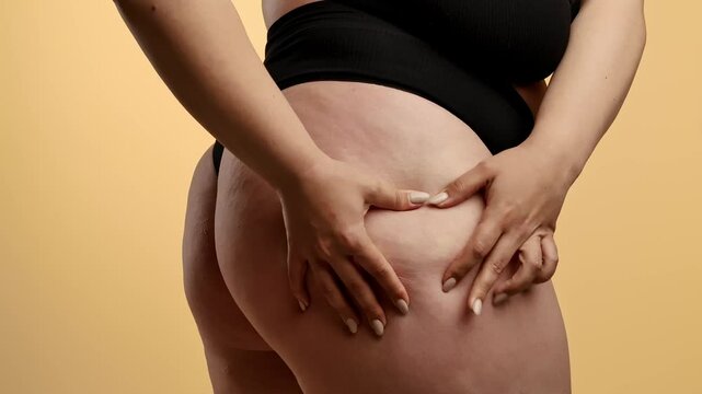 Woman Checking Thigh and Skin Texture in Underwear