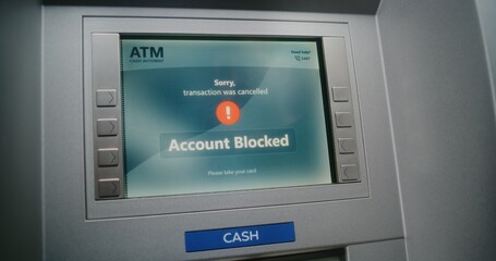 ATM User Entering PIN Code on ATM Keypad for Money Withdrawal. Error Message on Cash Machine Screen About Cancelled Transaction Due to Blocked Bank Account. Cash Transactions, Banking System. Close Up