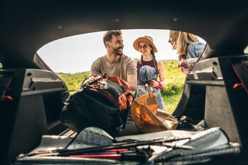 Friends Preparing Picnic From Stuffs From Car