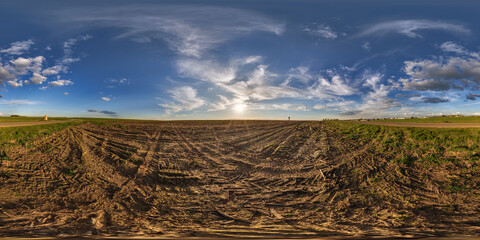 hdri 360 panorama view on gravel road among fields with clouds in sky in equirectangular full seamless spherical projection, ready for VR AR or sky dome replacement