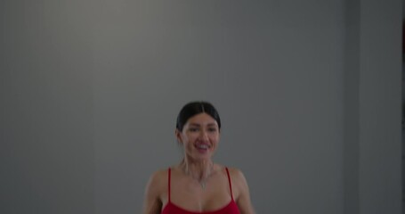 girl practices hand kneading in well lit indoor environment focusing on mindfulness and relaxation during wellness session dedicated to self care and mental well being.