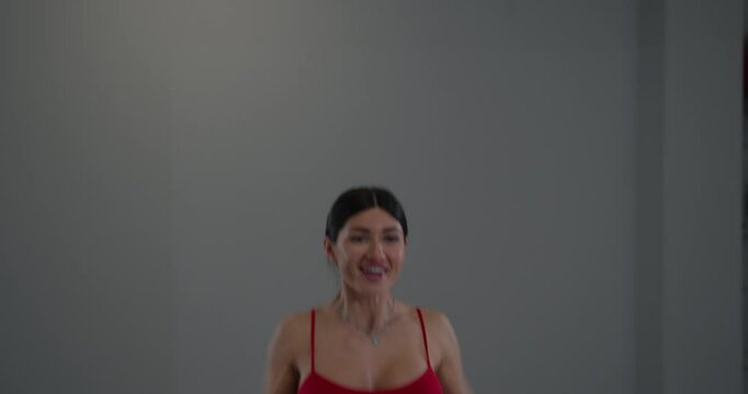 girl practices hand kneading in well lit indoor environment focusing on mindfulness and relaxation during wellness session dedicated to self care and mental well being.