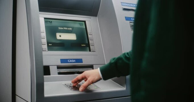 ATM User Entering PIN Code on ATM Keypad for Money Withdrawal. Error Message on Cash Machine Screen About Cancelled Transaction Due to Failed Authorization. Cash Transactions, Banking System. Close Up
