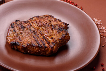 Meat, steak, beef tenderloin cooked on grill. Juicy steak as a food background