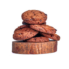 Crispy chocolate chip cookies arranged on a round wooden base with a white background, perfect for food content or advertising.