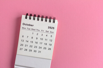 Hello, September 2025. Desktop calendar for planning on a pink background.