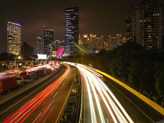 Night view of jakarta city downtown illuminated street traffic with skyscrapers. Jakarta city street