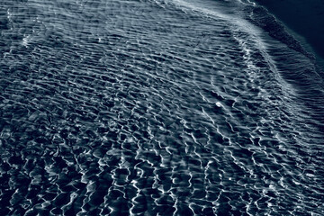 blue water surface with ripples