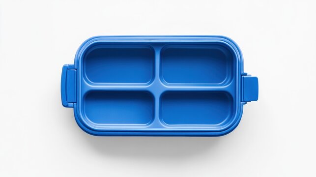 Overhead shot of an empty bright blue bento box with four compartments on a white surface top view