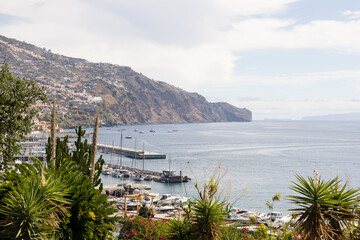 Funchal Marina and view of coastal and atlantic ocean in background. Madeira Island, Portugal.