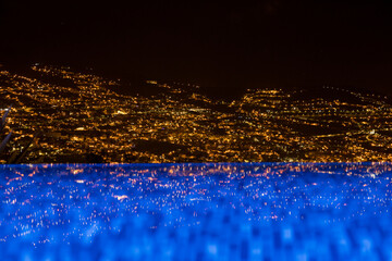 Cityscape of Funchal at night with reflection in lake. Madeira Island, Portugal