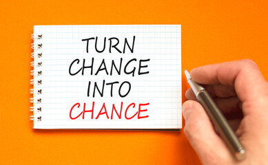 Turn change into chance symbol. Concept words phrase Turn change into chance on beautiful note....