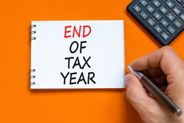 End of tax year symbol. Concept words phrase End of tax year on beautiful white note. Businessman's...